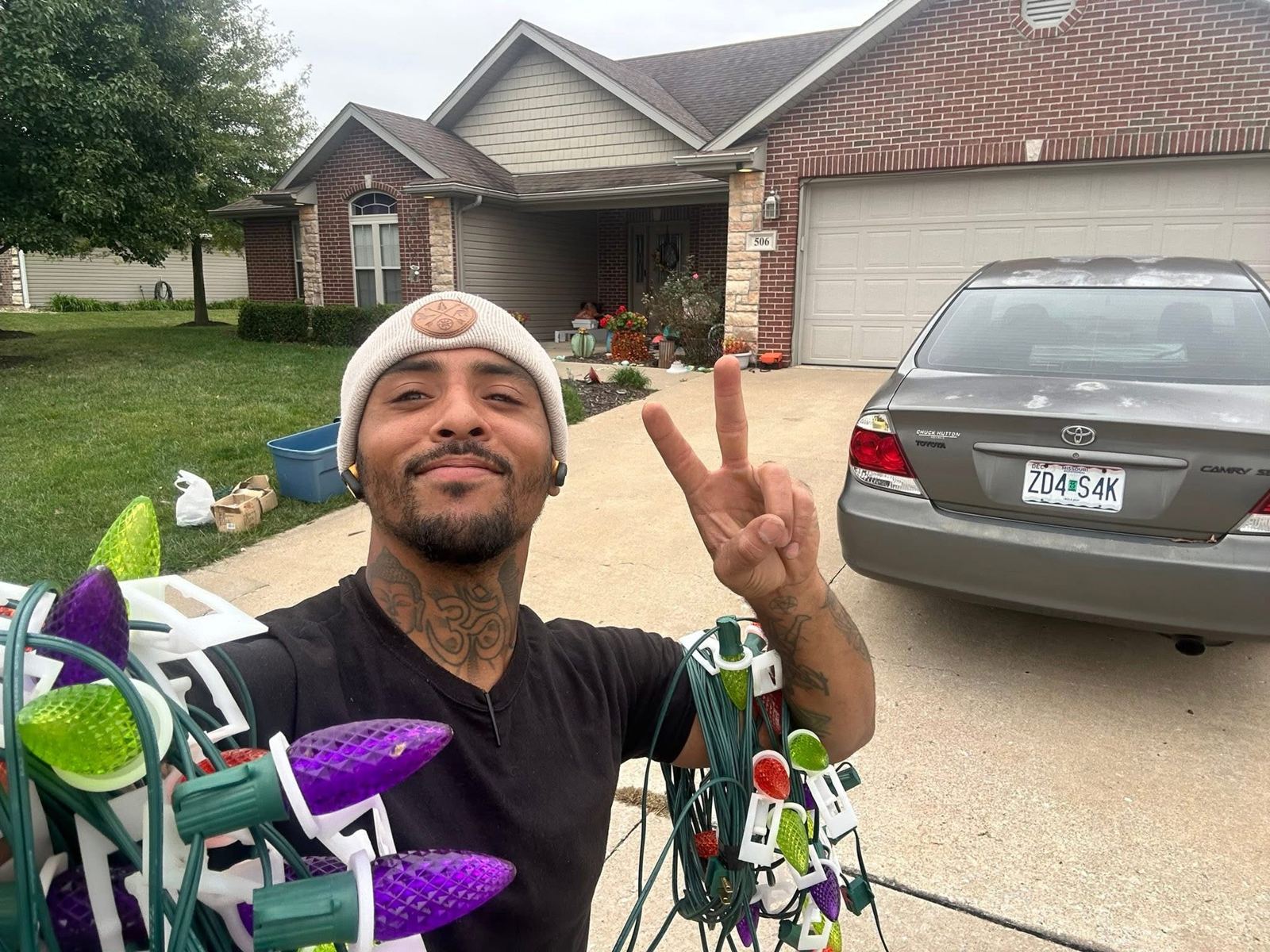 LaRon with a spool of holiday lights