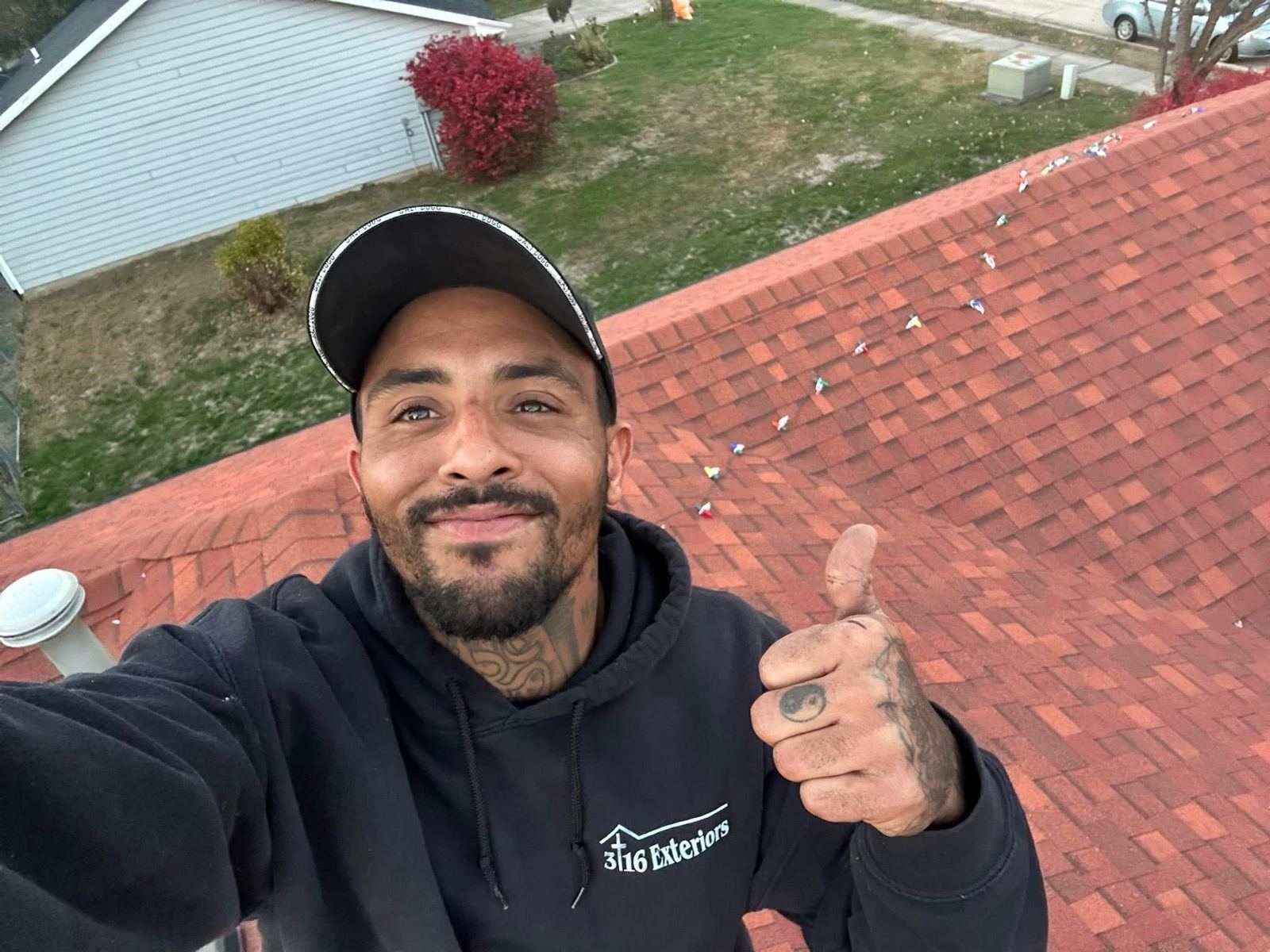LaRon on a roof during a lighting install
